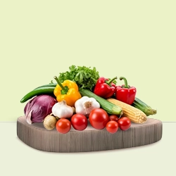 A variety of vibrant vegetables, including tomatoes, peppers, garlic, and corn, are on a wooden board.